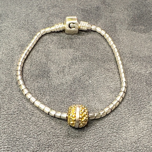 Chamilia Jewelry - Elegant Silver Chamilia 7” bracelet with Silver and gold bead.